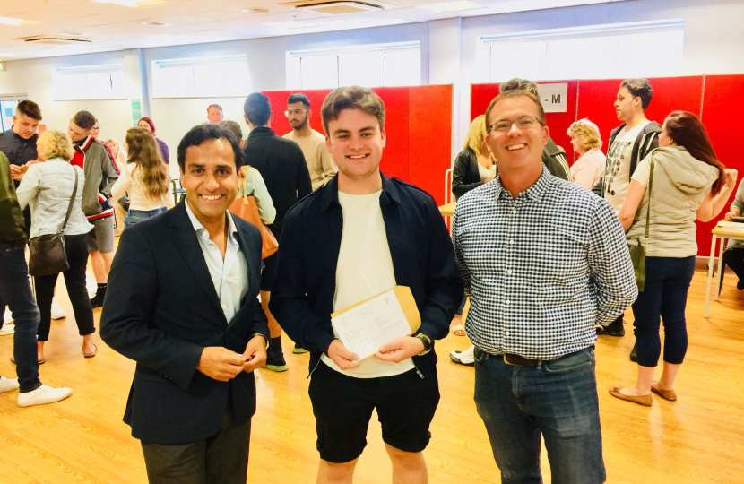 Rehman local A-level student receiving his results