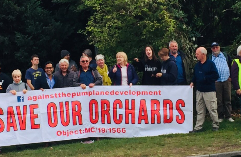 Rehman with local residents at demonstration