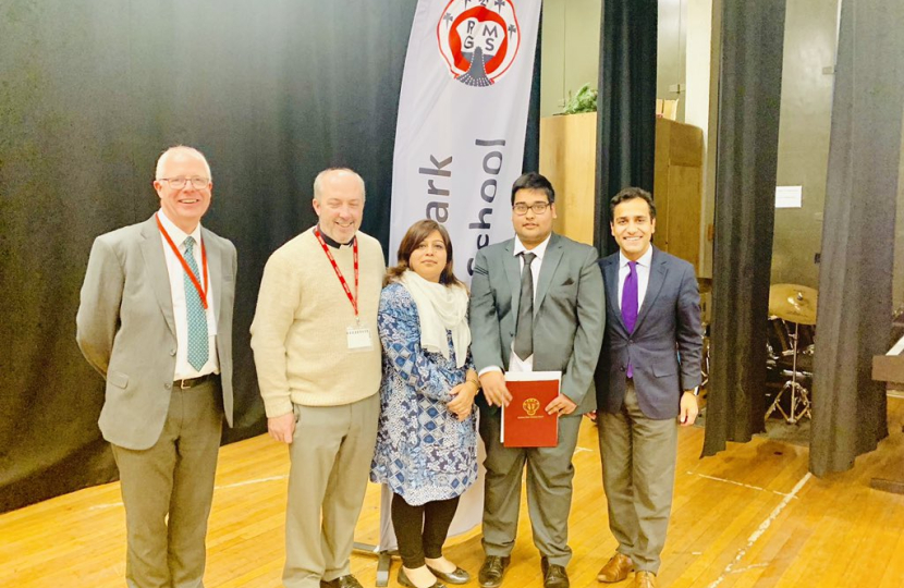 Rehman with teachers and his nephew at Rainham Mark Grammar School