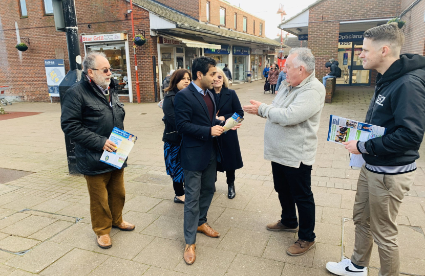 Rehman speaking with local residents