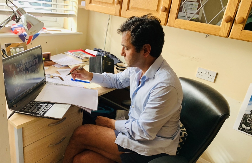 Rehman at his laptop speaking at the virtual event