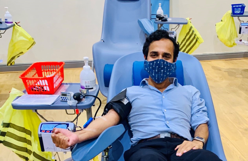 Picture of Rehman donating blood