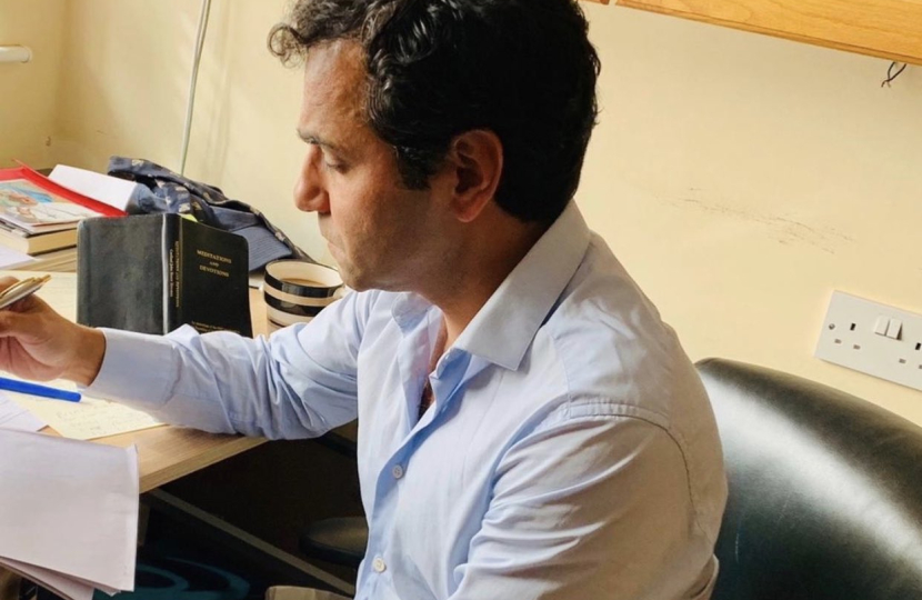 Rehman at his desk