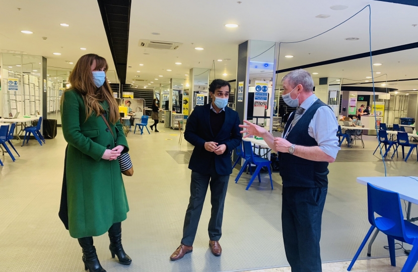 Picture of Rehman and Kelly Tolhurst MP speaking with staff