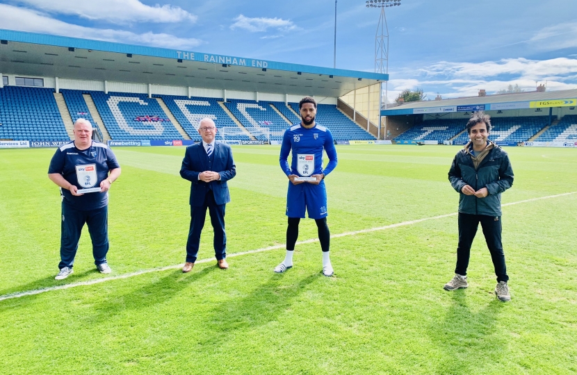 Rehman pictured with Gills FC Manager Steve Evans, Chairman Paul Scally and striker Vadaine Oliver