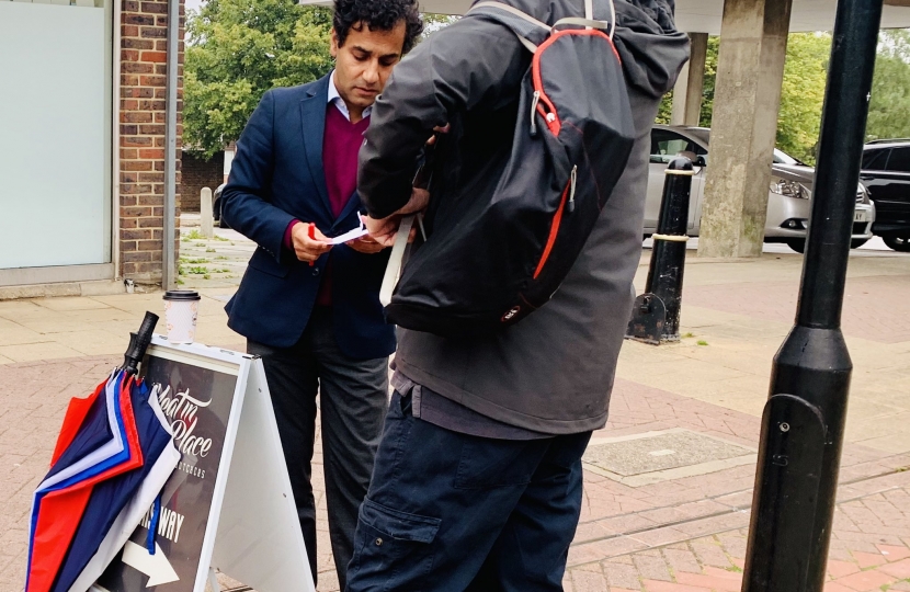 Rehman speaking with a constituent