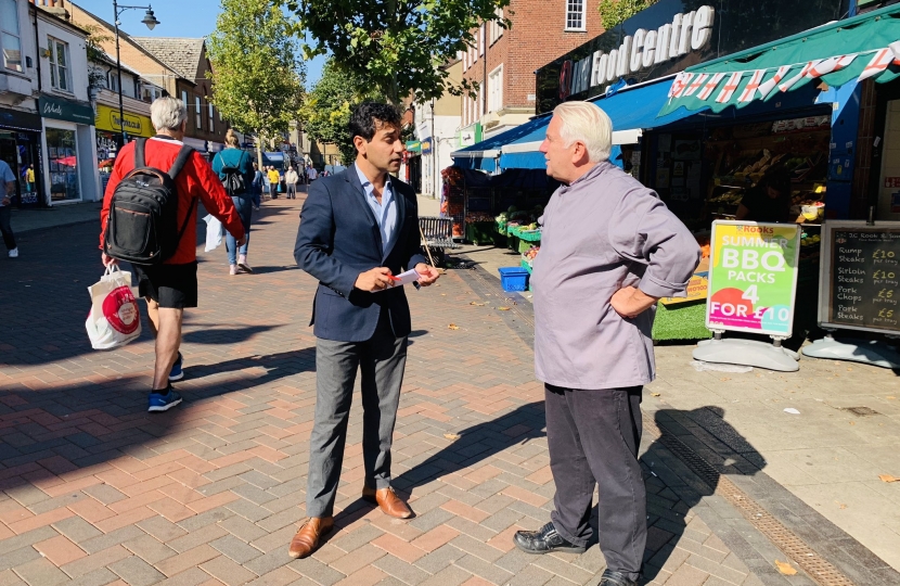 Rehman speaking with a constituent