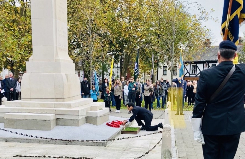 Rehman laying a wreath at the Remembrance Service