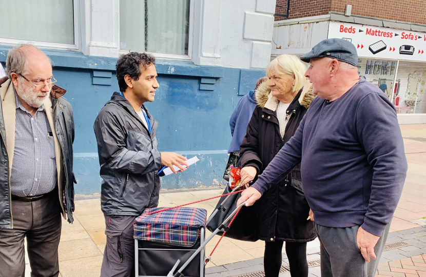 Rehman with local residents