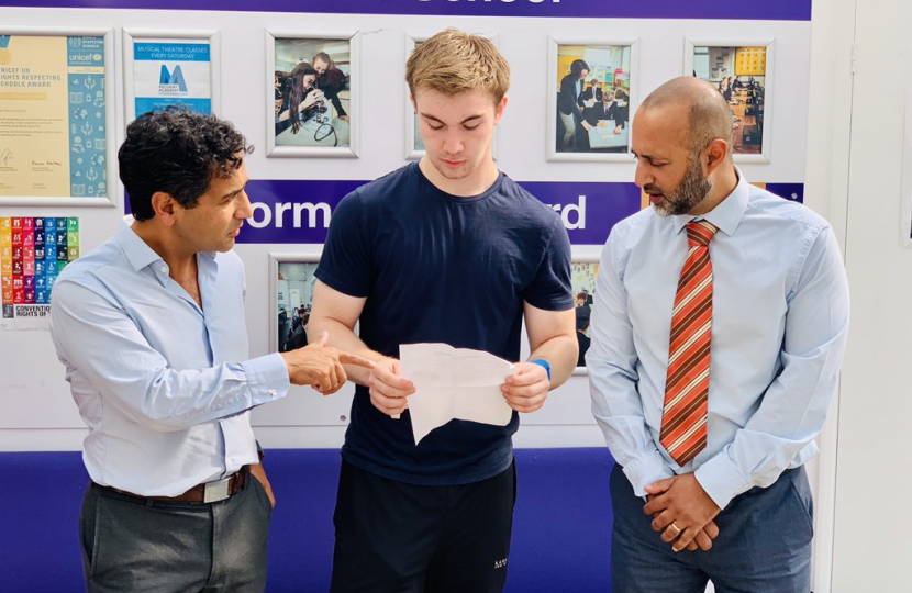 Rehman at a school with pupils