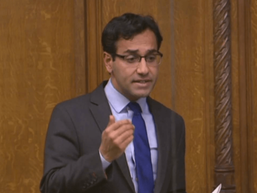 Rehman talking at the Aleppo debate