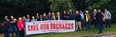 Rehman with local residents at demonstration