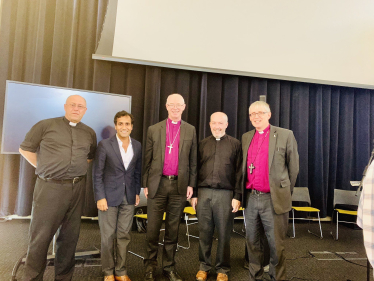 Rehman with organisers of the Conference