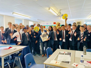 Rehman with students at Rainham Mark Grammar School