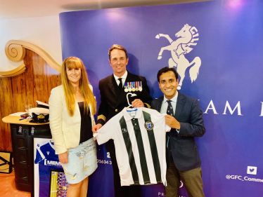 Rehman with Gills shirt and HMS Medway Commanding Officer