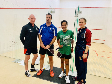 Rehman with other squash players at the competition