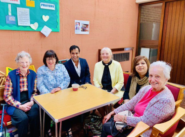 Rehman with Sunday Service attendees