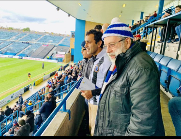 Rehman watching football at Priestfield