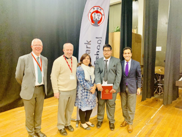 Rehman with teachers and his nephew at Rainham Mark Grammar School