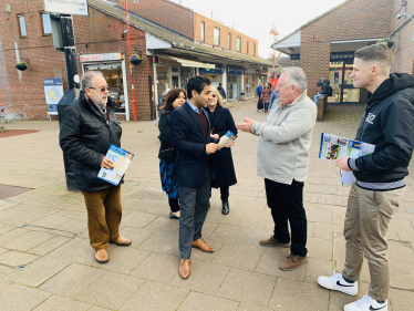 Rehman speaking with local residents