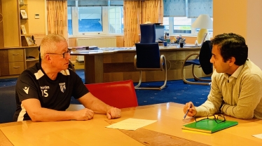 Rehman with Chairman Paul Scally