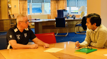 Rehman with Chairman Paul Scally