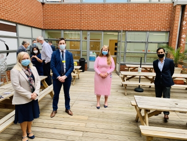 Rehman outside Medway Hospital with the Chief Executive and staff