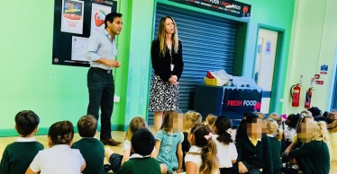 Rehman speaking to pupils