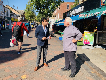 Rehman speaking with a constituent