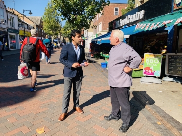 Rehman speaking with a constituent