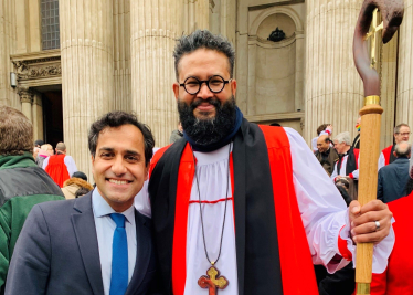 Rehman with Reverend Saju