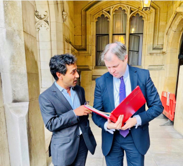 Rehman with the Minister