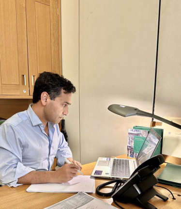 Rehman on a call with the medical cancer care team at Medway hospital