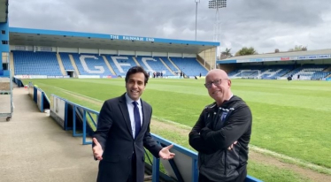 Rehman with Gillingham FC Chairman, Paul Scally 